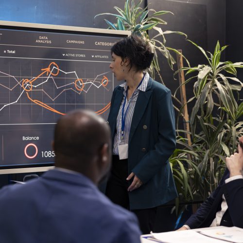 Team members attending conference in a boardroom and presenting the situation, trying to detect challenges or obstacles hindering progress. Supervisor and staff struggling with a project.